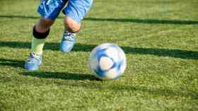 Kid playing football