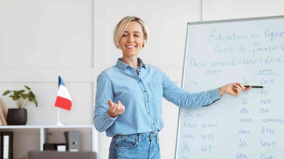 Young French teacher in front of a class