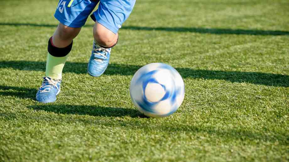 Kid playing football