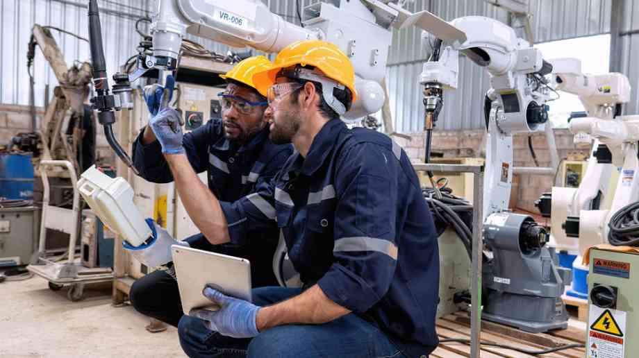 Young engineering apprentice with mentor