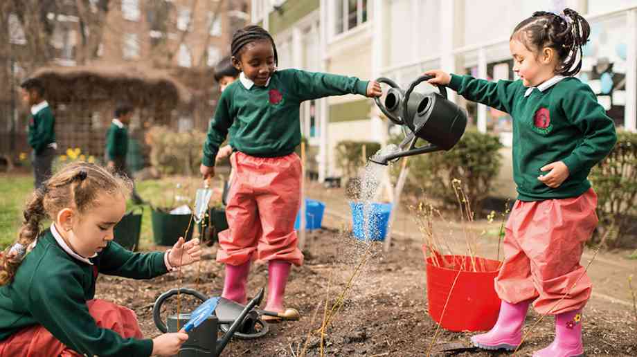 Griffin Primary School students watering trees