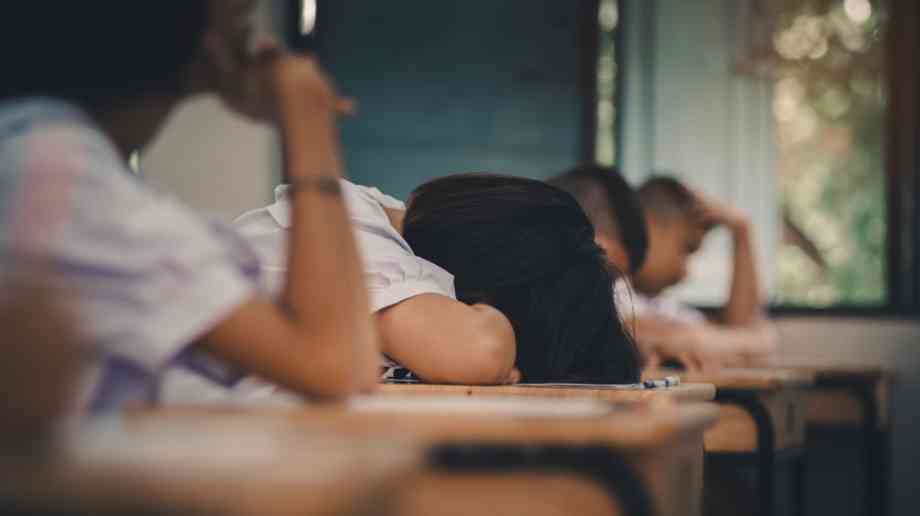 Students with heads on desk